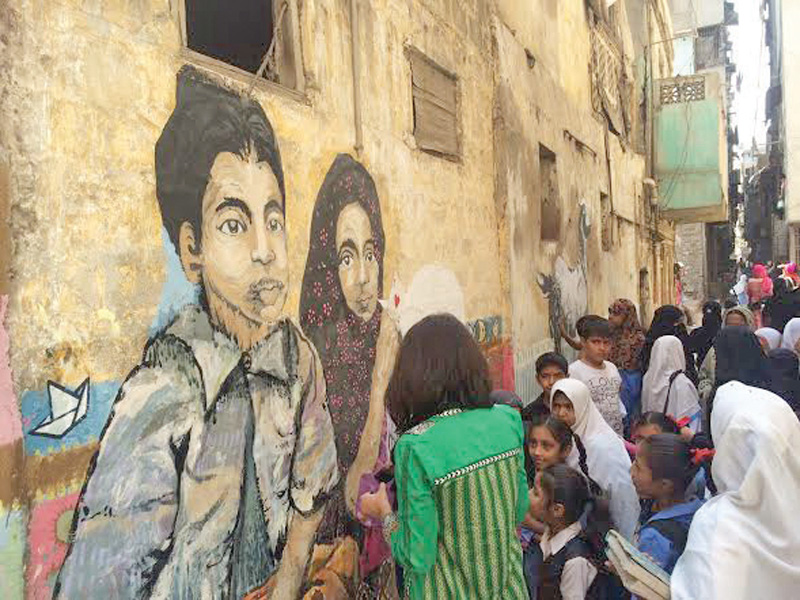 The Fearless Collective painted a few walls in Lyari on Wednesday morning with excited children watching them work. The paintings were based on the theme, ‘play’. PHOTO: EXPRESS