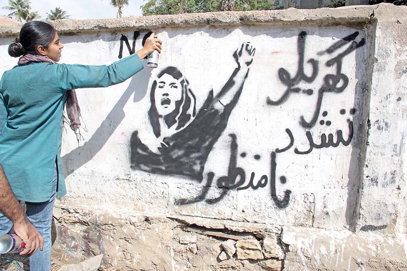 Young men and women took to street art and painted slogans and images against domestic violence, street harassment, identity crisis, stereotypes and rape in Gulshan-e-Iqbal, North Nazimabad, Saddar, Tower, II Chundrigarh Road, Karachi Press Club and Numaish. PHOTOS: AYESHA MIR/EXPRESS
