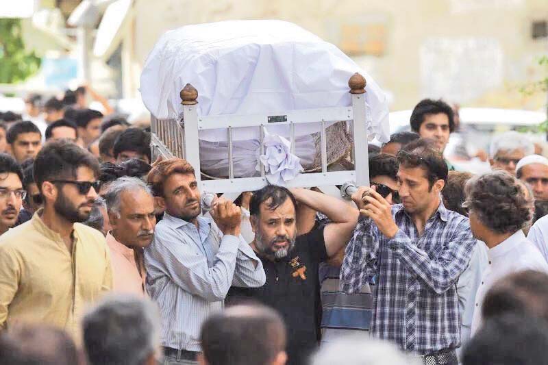 Slain activist Khurram Zaki shoulders the coffin of Sabeen Mahmud, the director of T2F, after she was gunned down by armed assailants last year. PHOTO: COURTESY SOCIAL MEDIA