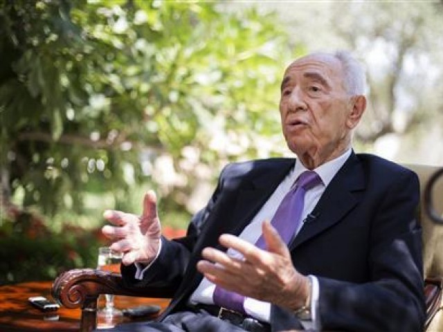 Israel's President Shimon Peres speaks during an interview with Reuters at his residence in Jerusalem June 16, 2013. PHOTO: REUTERS