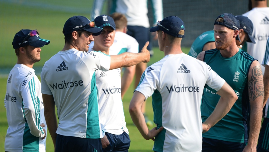 England's Ben Duckett (L), Gareth Batty (3L), Keaton Jennings (2R) and Ben Stokes (R) listen as captain Alastair Cook (2L) speaks during a training session at the Wankhede stadium ahead of the fourth test cricket match between India and England in Mumbai on December 6, 2016.
PHOTO: AFP