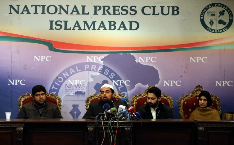 Mufti Faisal Khushi speaks as Mesha Saeed (R), wife of missing social activist Waqass Goraya, Jibran Nasir (2ndR) a human rights lawyer and Faraz Haider (L), brother of missing social activist Salman Haider, listen during a news conference in Islamabad, Pakistan January 18, 2017. PHOTO: REUTERS