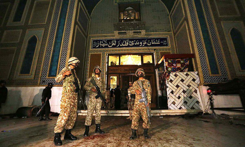 Soldiers stand guard outside Lal Shahbaz Qalandar's shrine. PHOTO: APP