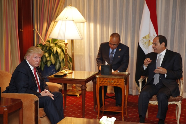 Donald Trump (L) looking on as Egyptian President Abdel Fattah el-Sisi speaks during a meeting at the Plaza Hotel in New York. PHOTO: AFP