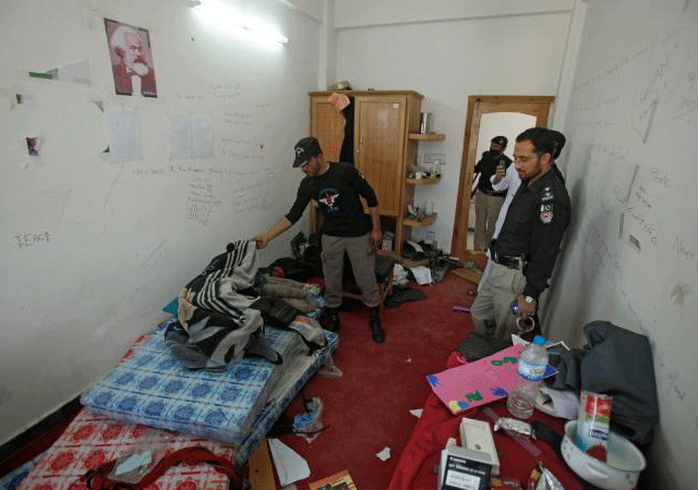 Police search the dorm room of Mashal Khan, accused of blasphemy, who was killed by a mob at Abdul Wali Khan University in Mardan, Pakistan April 14, 2017. PHOTO: REUTERS