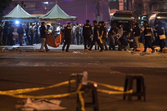 Police investigate the scene of an explosion at a bus station in Kampung Melayu, East Jakarta, Indonesia. PHOTO: REUTERS