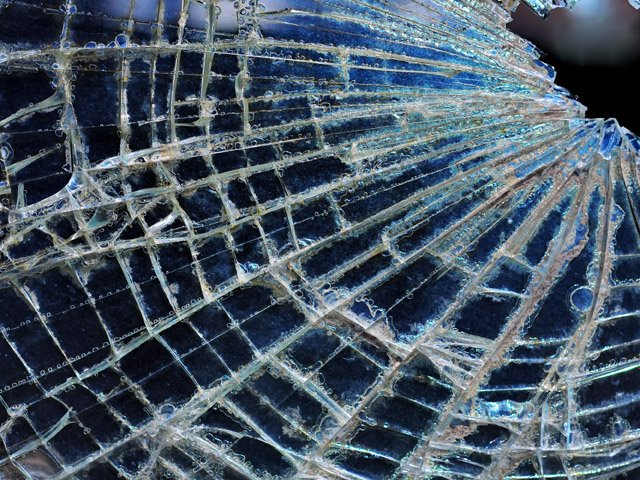 A coach coming from Mardan to Bajaur rammed into a truck parked along the road near Gujar Ghari in Takhtabai tehsil. PHOTO: EXPRESS