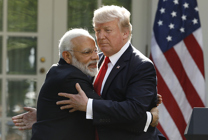India's Prime Minister Narendra Modi hugs US President Donald Trump as they give joint statements in the Rose Garden of the White House in Washington, US June 26, 2017. REUTERS/
