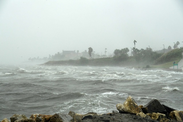 Strong winds batter seaside houses before the approaching Hurricane Harvey in Corpus Christi, Texas on August 25, 2017. Hurricane Harvey will soon hit the Texas coast with forecasters saying it's possible for up to 3 feet of rain and 125 mph winds
PHOTO: AFP
