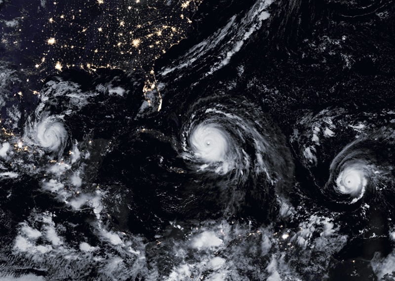 This satellite image obtained from NASA's Earth Obervatory on Septermber 8, 2017 shows Hurricane Irma (C), Hurricane Jose (R), and Hurricane Katia. PHOTO: AFP