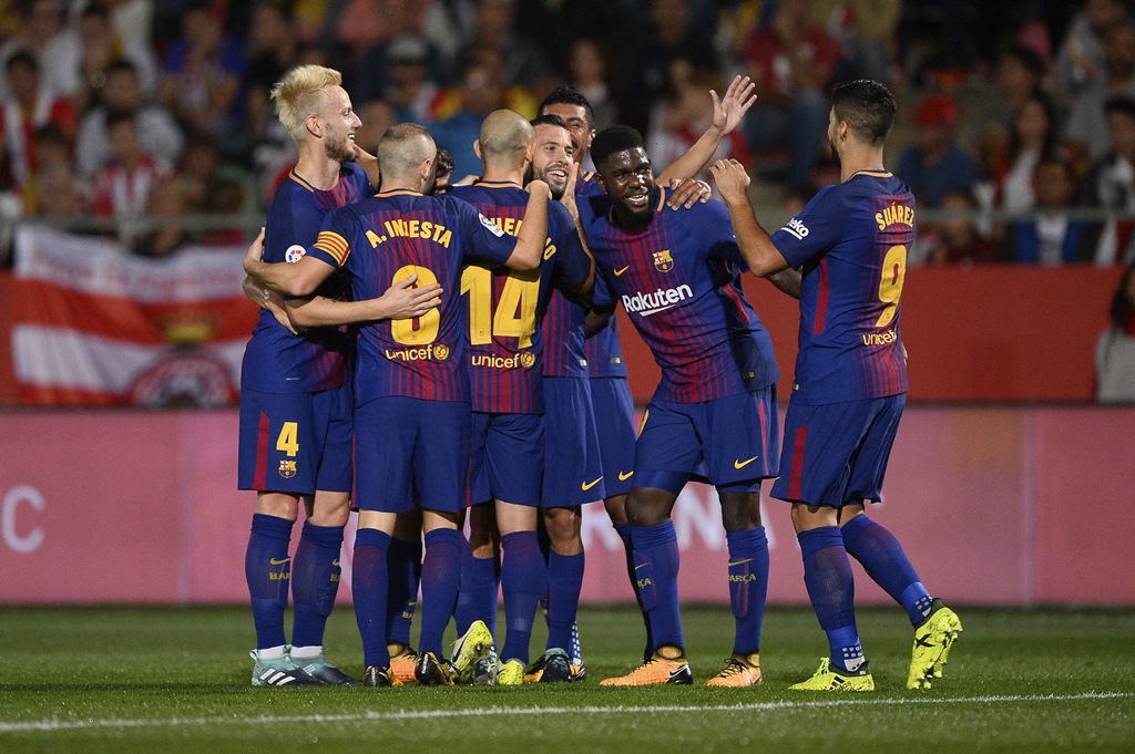 Easy does it: Barcelona were rarely troubled in 3-0 win over fellow Catalan side Girona. PHOTO: AFP