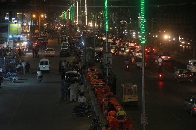 Encroachments appeared on University Road weeks after its inauguration. PHOTO: ATHAR KHAN