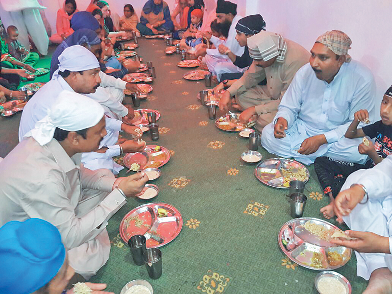 Sikh devotees mark the 549th birthday of Guru Nanak in Peshawar. PHOTOs: EXPRESS