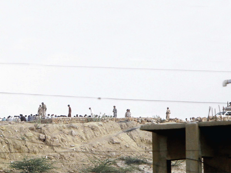 This September 8 photo shows Rangers officers detaining suspected members of a land grabbing mafia. PHOTO: EXPRESS