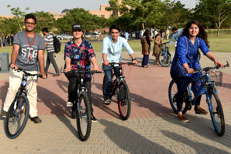 A group of students riding bikes at the soft launch of CYKIQ at NUST campus, Islamabad. PHOTO: REUTERS