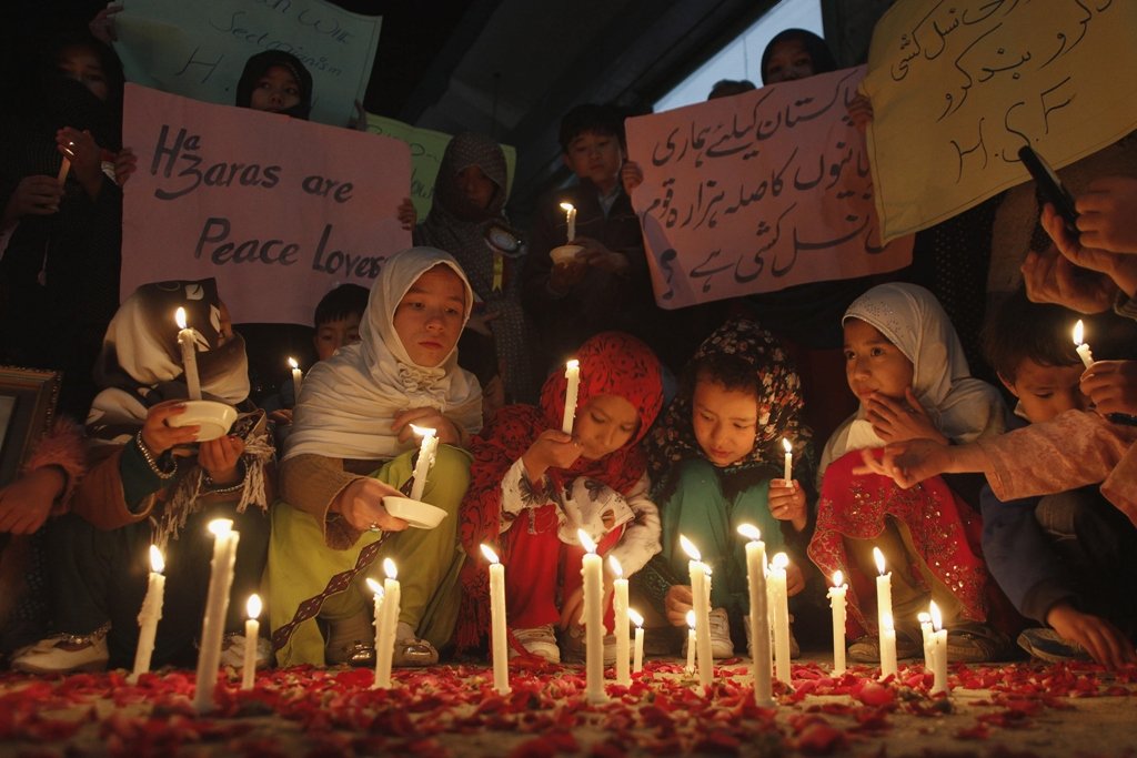 Members of a Hazara community light candles for peace against sectarian attacks in Quetta February 15, 2014. PHOTO: REUTERS