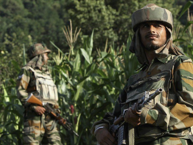 Indian army soldiers patrol near the Line of Control, a ceasefire line dividing Kashmir between India and Pakistan, in Poonch district in this August 7, 2013 file photo. PHOTO: REUTERS
