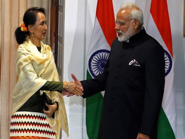 Myanmar's State Counsellor Aung San Suu Kyi shakes hands with India's Prime Minister Narendra Modi during a photo opportunity ahead of their meeting at Hyderabad House in New Delhi, India. PHOTO: REUTERS