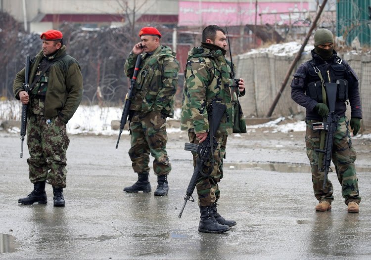 Afghan National Army (ANA) soldiers stand guard at the entrance gate of Marshal Fahim military academy in Kabul, Afghanistan. PHOTO: REUTERS