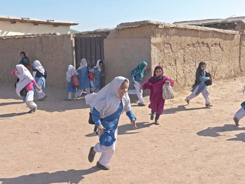 Children rush out of school. PHOTO: REUTERS