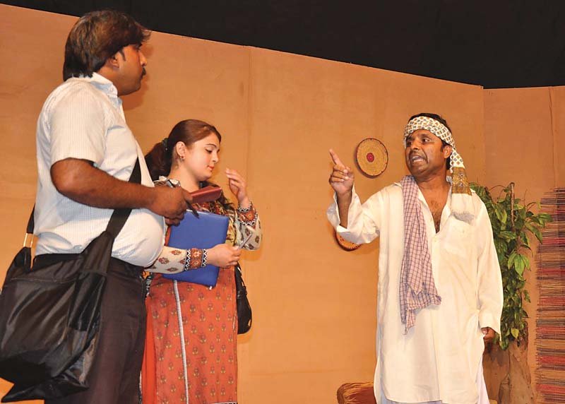 Actors performing in a stage play held by the Rawalpindi arts council. PHOTO: Express