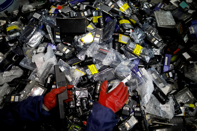 An employee sorts out old batteries at an urban mining plant in Gunsan April 2, 2018.
PHOTO: REUTERS