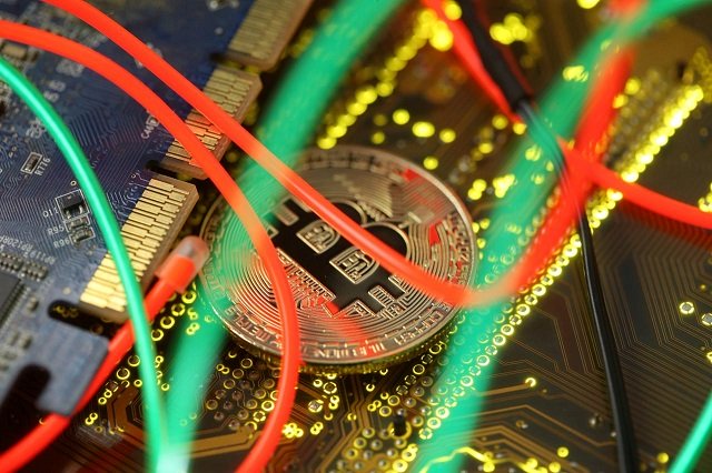 Representation of the Bitcoin virtual currency standing on the PC motherboard is seen in this illustration picture, February 3, 2018.
PHOTO: REUTERS