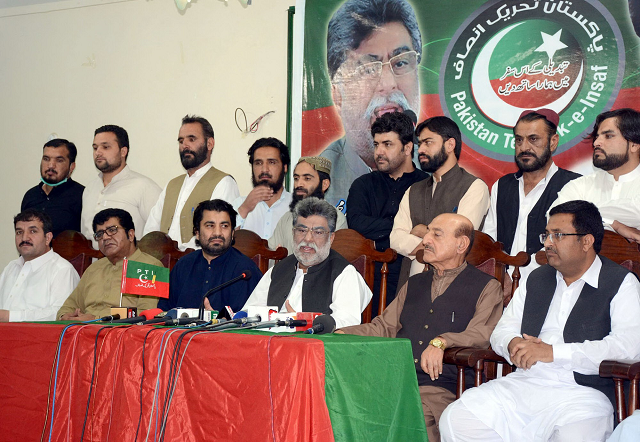 PTI Provincial President Yar Muhammad Rind addressing a press conference after former provincial minister Shahnawaz Marri and others joined the party. PHOTO: EXPRESS