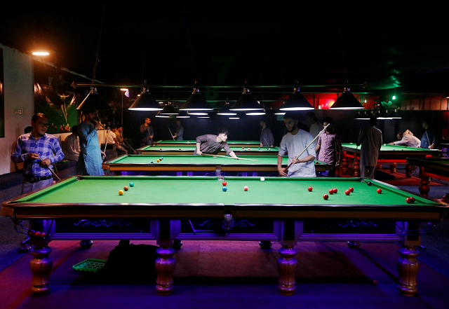 Afghan youth play snooker in Kabul.
PHOTO:REUTERS