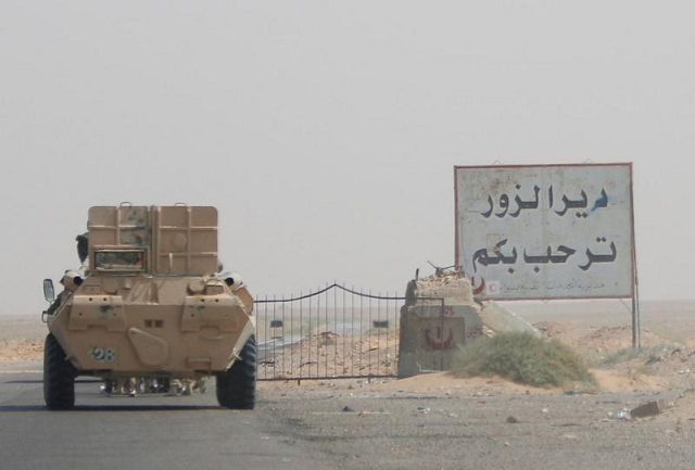 An armoured vehicle drives through oilfield. PHOTO: REUTERS