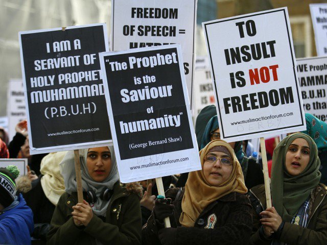 Muslim demonstrators protest near Downing Street in central London on February 8, 2015. PHOTO: AFP