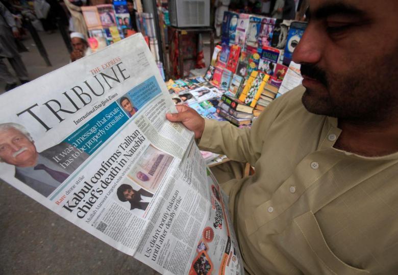 A man reads a newspaper containing news. PHOTO: REUTERS