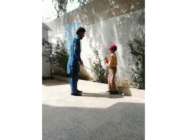 In the footage, the academician is seen beating the helpless, minor child repeatedly with a stick. PHOTO: VIDEO SCREEN GRAB