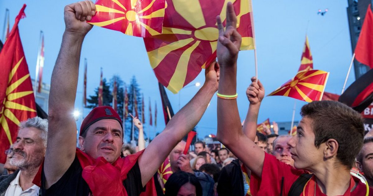 Supporters of the biggest opposition party, conservative VMRO-DPMNE wave flags during a protest in front of a Government building
PHOTO: AFP