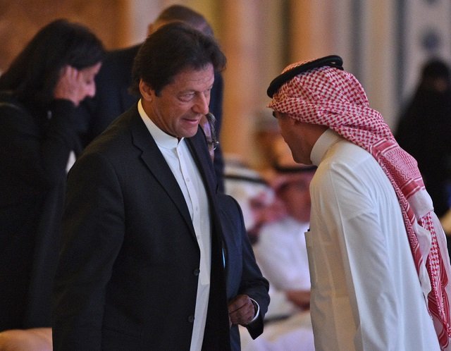 A picture taken October 23, 2018 shows Pakistani Prime Minister Imran Khan(C) as he arrives to attend the opening ceremony of the Future Investment Initiative FII conference taking place in Riyadh from 23-25 October. PHOTO: AFP