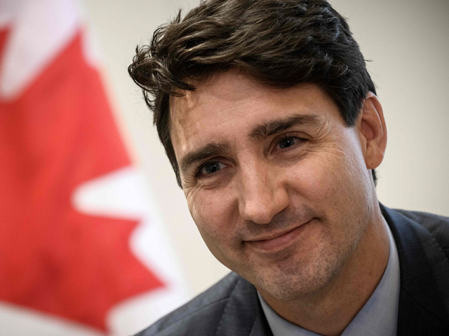 Canadian Prime Minister Justin Trudeau looks on during an interview at the Canadian Embassy in Paris on November 12, 2018. PHOTO: AFP