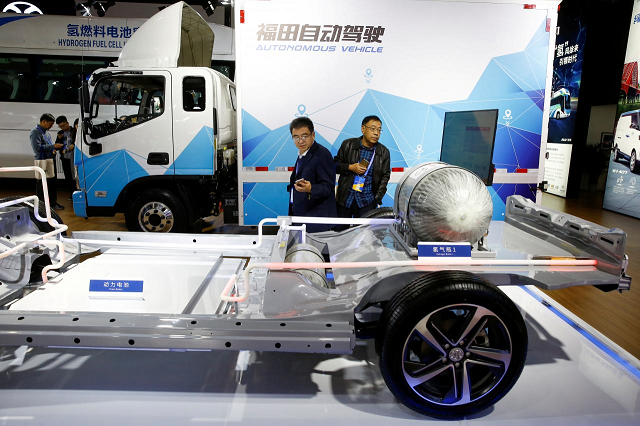 Visitors looks at the frame of an electric vehicle next to a Foton autonomous truck at the stall of the BAIC Group automobile maker at the IEEV New Energy Vehicles Exhibition in Beijing, China October 18, 2018.
PHOTO: REUTERS