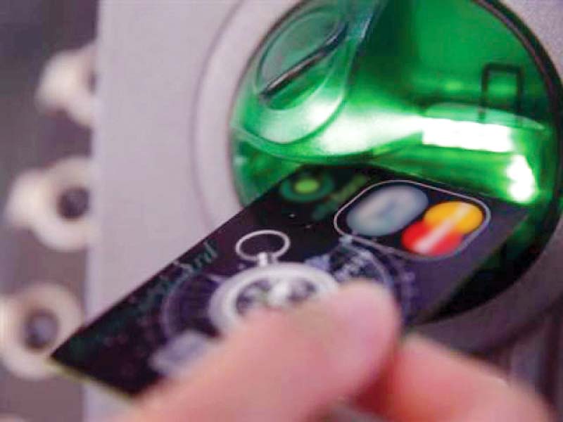 ATM users should hide keypad with one hand while entering PIN code, as sometimes thieves install hidden micro camera near and around the keypad. PHOTO: REUTERS