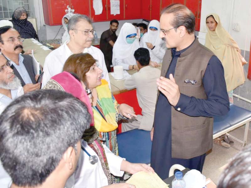 Federal Health Minister Aamer Mehmood Kiani listens to the problems of doctors during is visit to the Polyclinic on Saturday. PHOTO: WASEEM NAZIR/EXPRESS