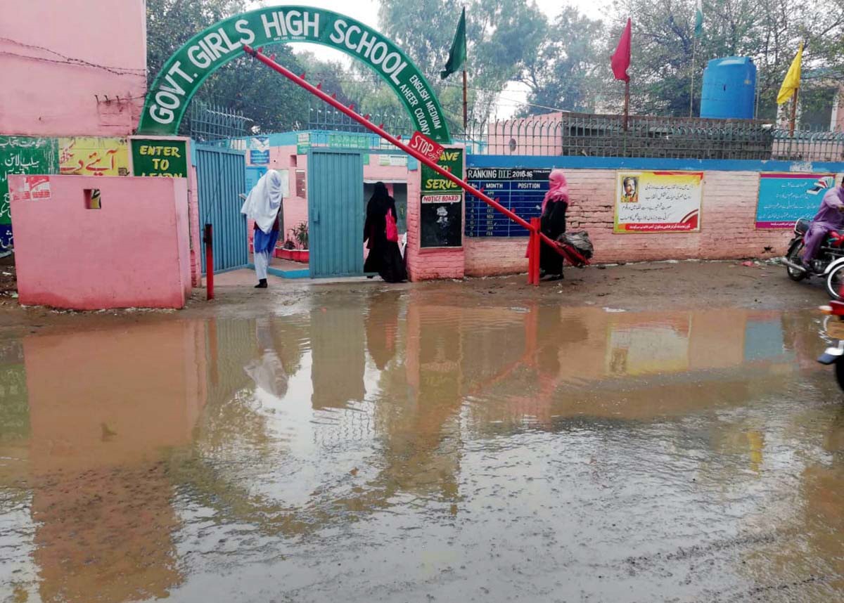 Rainwater accumulated in front of a school in Sargodha. PHOTO: APP