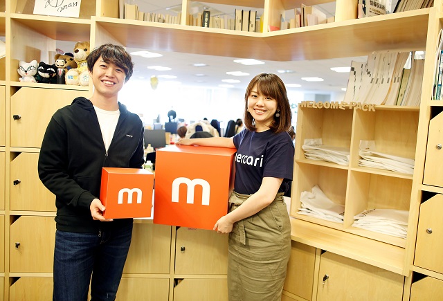 Employees of Mercari Inc. Takashi Murakami and Ayano Okuda pose for a photograph at the company office in Tokyo, Japan, December 5, 2018. Photo: Reuters
