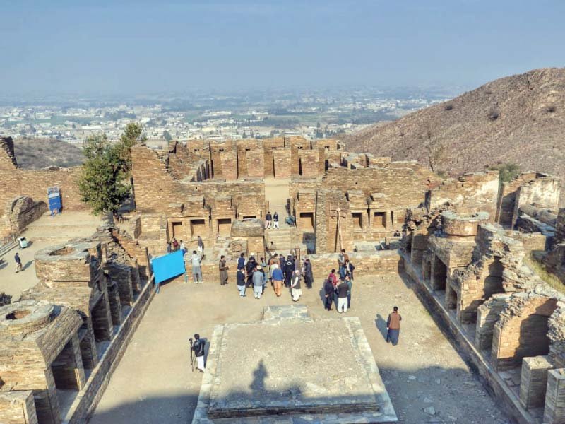 Senior Minister Atif Khan and officials during visit to the Takht Bahi Buddhist site. PHOTO: EXPRESS