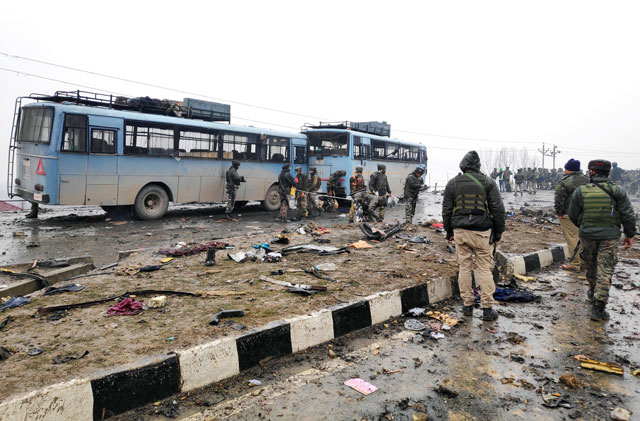 Indian soldiers examine the debris after an explosion in occupied Kashmir's Pulwama district on Thursday. PHOTO: REUTERS