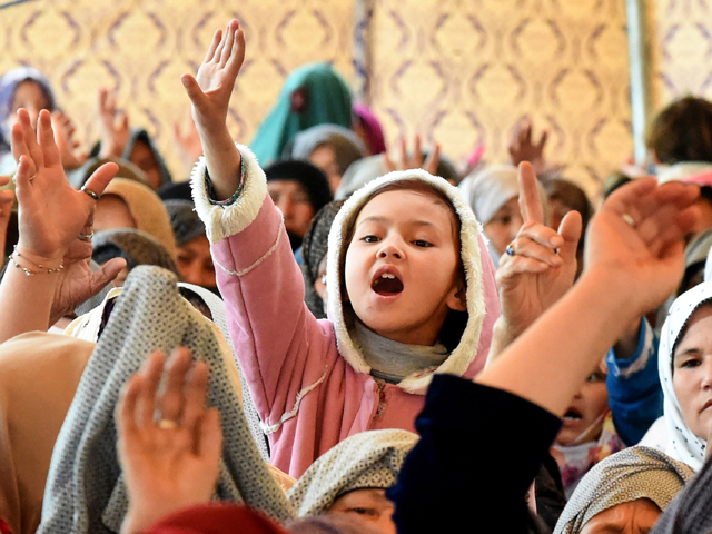 A young Pakistani mourner of the Shia Hazara ethnic minority shout slogan as she sits-in during a protest in Quetta on April 15, 2019, PHOTO: AFP