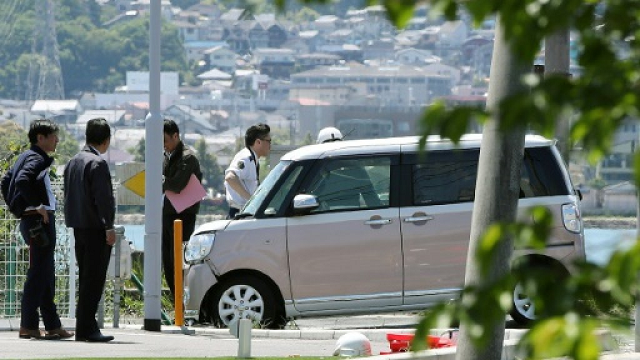 Police said the car veered onto the pavement after making 'contact' with another larger vehicle. PHOTO: AFP
