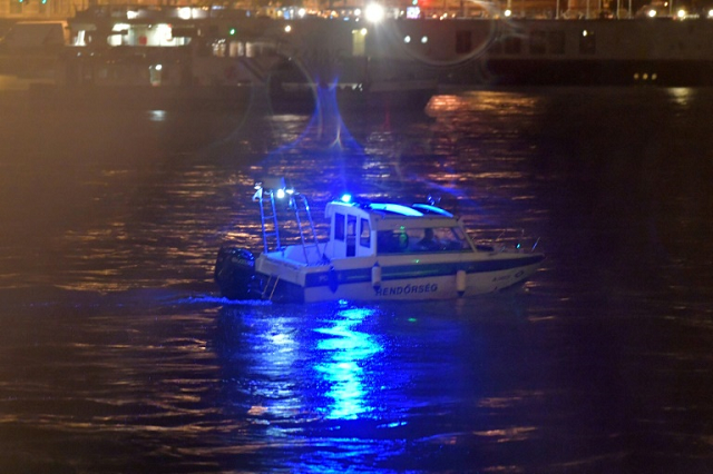 Police search for survivors after the Hungarian 'Hableany' (Mermaid) riverboat capsized after a collision on the Danube River in Budapest. PHOTO: AFP