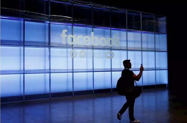 An attendee takes a photograph of a sign during Facebook Inc's F8 developers conference in San Jose, California, US, April 30, 2019.
PHOTO: REUTERS