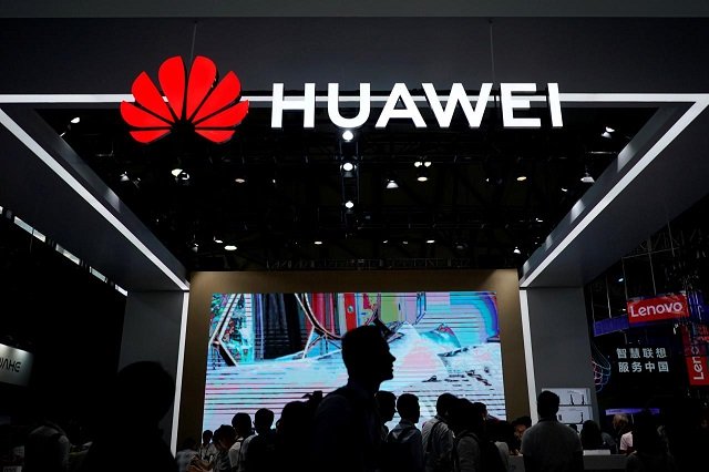People walk past a Huawei sign at CES (Consumer Electronics Show) Asia 2018 in Shanghai, China June 14, 2018.
PHOTO: REUTERS