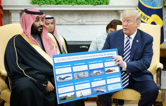 US President Donald Trump (R) is seen holding a defense sales chart with Crown Prince Mohammed bin Salman of Saudi Arabia, a country to which US lawmakers have expressed concern about selling weapons that might be used against Yemeni civilians. PHOTO: AFP