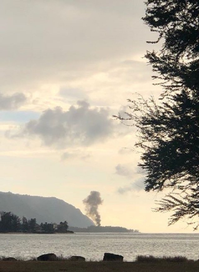 A plume of smoke rises after an airplane crash, seen from Kaiaka Bay Beach Park, in Haleiwa, Hawaii, US. PHOTO: REUTERS
